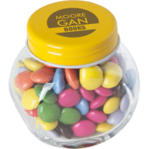 Kleine glazen pot gevuld met ca. 40 gr. choco carletties gekleurd deksel