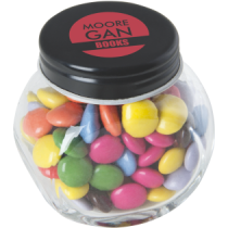 Kleine glazen pot gevuld met ca. 40 gr. choco carletties gekleurd deksel